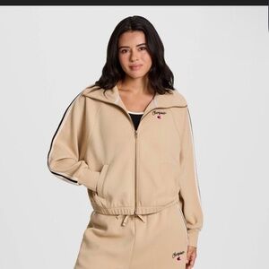 Champion Beige zip up jacket with Logo and stripe on arm. Soft and cozy size M